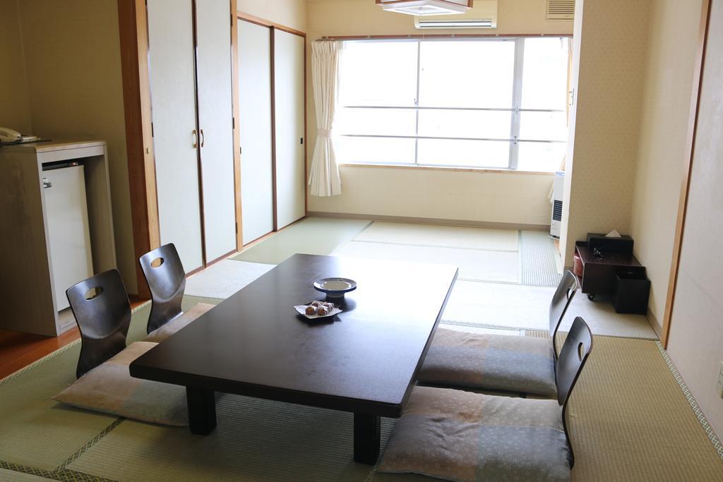 Hotel Sankeien Sapporo Habitación foto