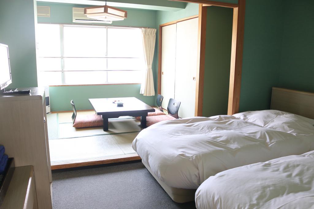 Hotel Sankeien Sapporo Habitación foto