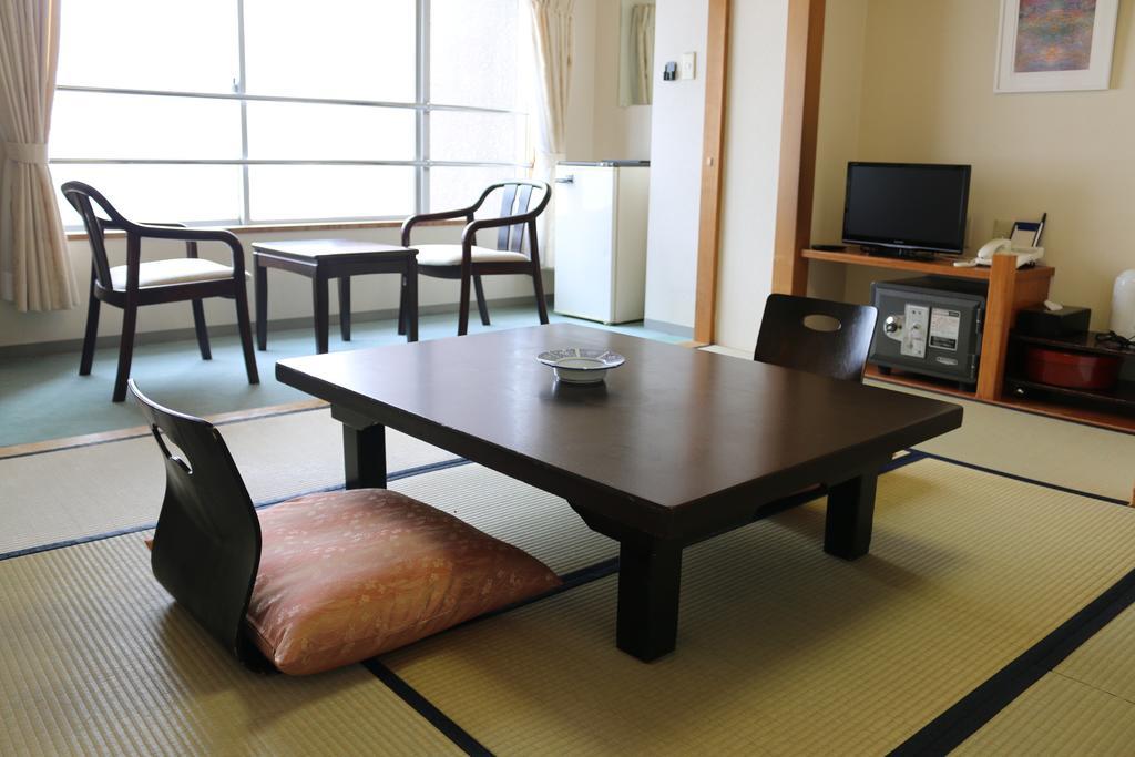 Hotel Sankeien Sapporo Habitación foto